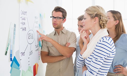 A group of coworkers talking in a recreational space